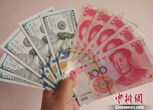 資料圖:人民幣和美元。<a target='_blank' _fcksavedurl='http://www.chinanews.com/' ></table>中新網(wǎng)</a>記者 李金磊 攝